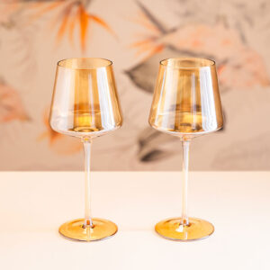 Pair of amber iridescent wine glasses.