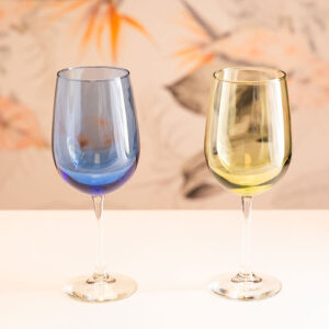 Two colored wine glasses; blue and green.