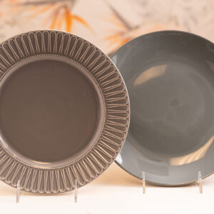 Gray dinner plates; one ornate, one plain. Orlando event rentals.