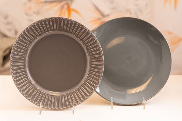 Gray dinner plates; one ornate, one plain. Orlando event rentals.