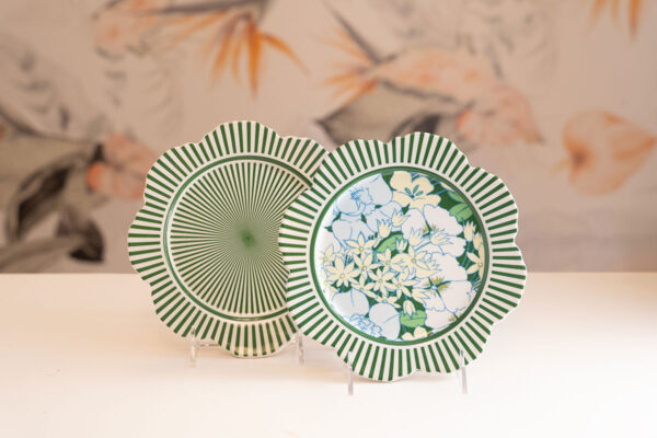 Scalloped green striped plates; one floral, one striped.